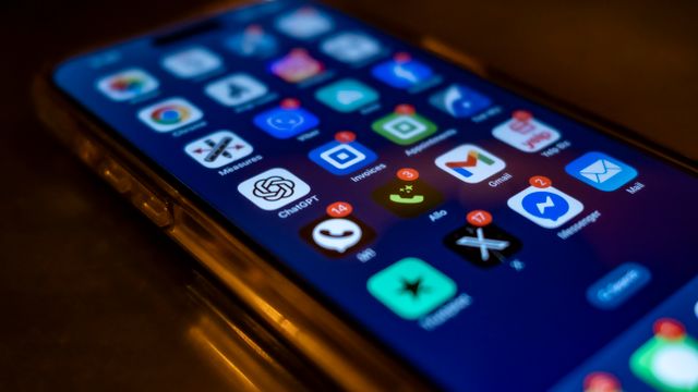 Smartphone home screen with unread notification badges on messaging apps